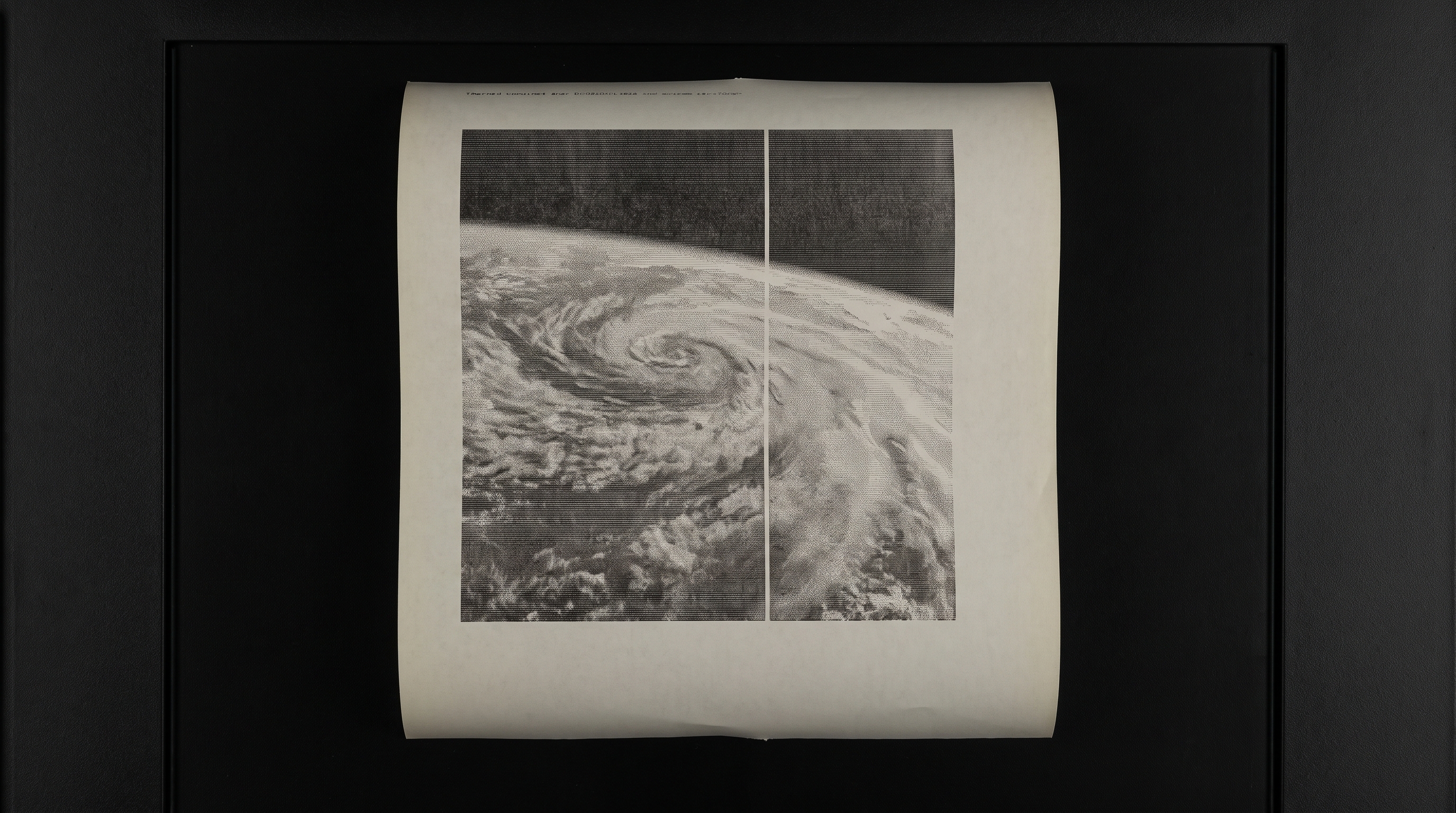 A fax-quality satellite image printout, grainy and faint, banding artifacts across the frame.